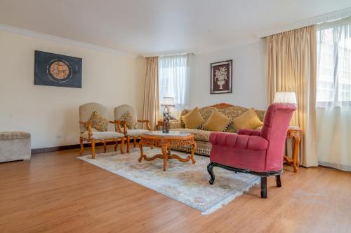 a living room with a couch and a table at The Grand Palace Hotel in Addis Ababa