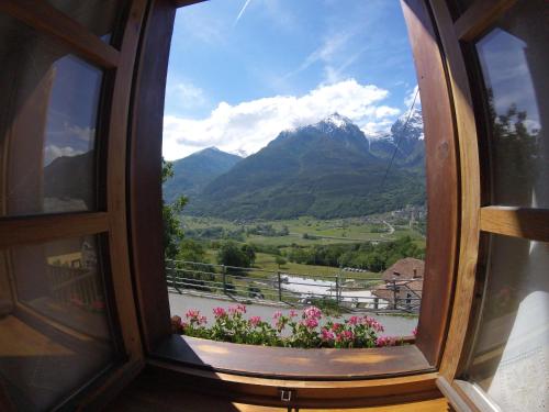 a window with a view of a mountain at B&B La Mandorla in Quart