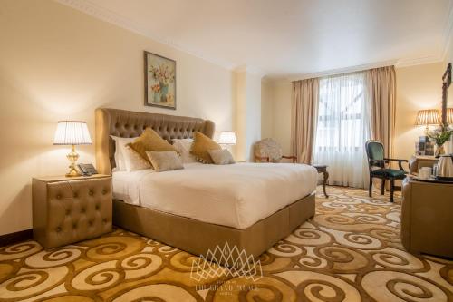 Katil atau katil-katil dalam bilik di The Grand Palace Hotel