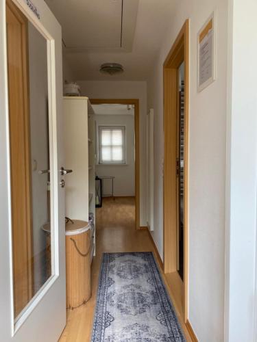 an open hallway with a rug in a house at Susewind in Bad Segeberg