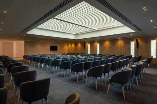 a large room with chairs and a large skylight at Tanoak Resort in Ain Sokhna