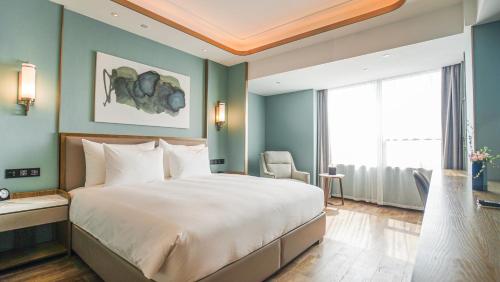 Postel nebo postele na pokoji v ubytování Xian heng Hotel