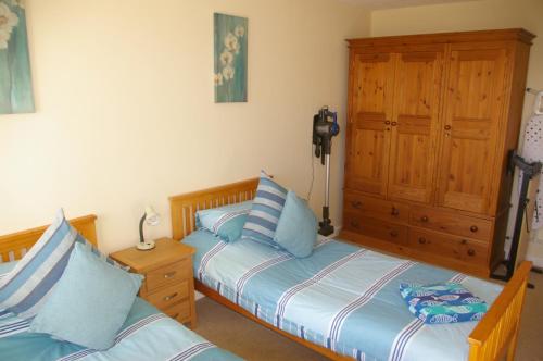 Ένα ή περισσότερα κρεβάτια σε δωμάτιο στο Ty Nant Cottages and Suites