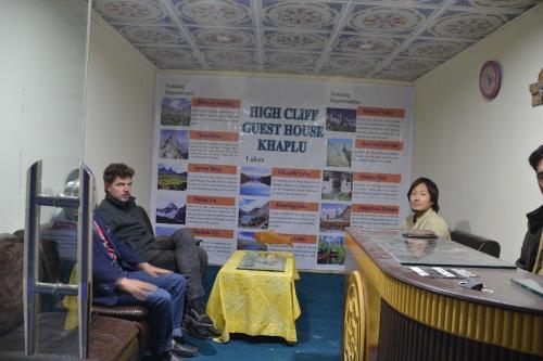 a group of people sitting in a room at High Cliff Guest House in Khaplu