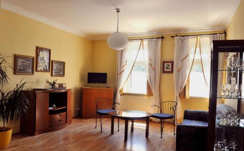 a living room with a table and chairs at Festival in Karlovy Vary