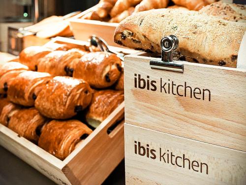 a display of lots of different types of bread at ibis Gent Centrum Opera in Ghent
