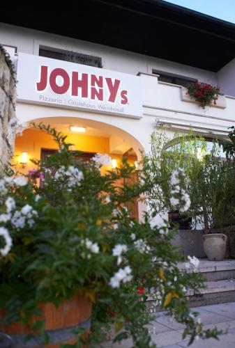 a johys sign on the side of a building at Gästehaus Elisabeth Weinhandl in Podersdorf am See