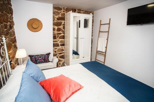 Ένα ή περισσότερα κρεβάτια σε δωμάτιο στο Casa Rural Costa Azul