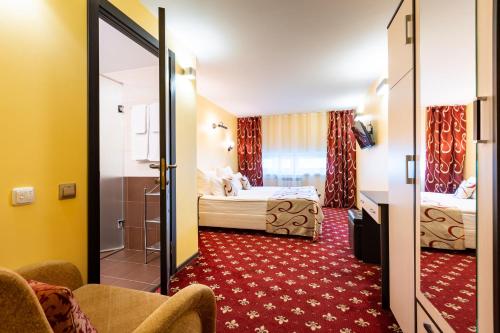 En eller flere senge i et værelse på Jenavi Club Hotel