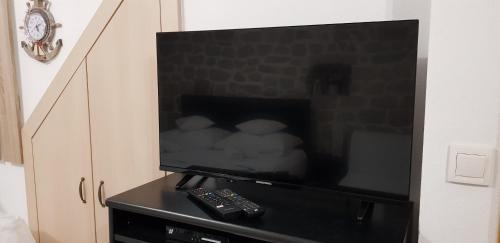 a flat screen tv sitting on top of a cabinet at Antea in Split