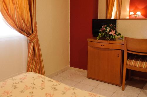 TV a/nebo společenská místnost v ubytování Hotel Dunas Puerto
