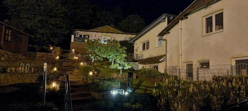 a house with lights on the stairs in a yard at Haus Krabbe mit Strandkorb inkl in Göhren