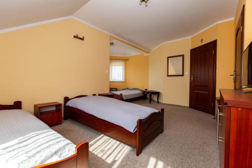 Postel nebo postele na pokoji v ubytování Willa Gizela