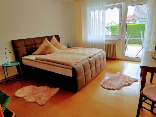 מיטה או מיטות בחדר ב-Gästehaus Diemer