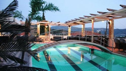 a swimming pool on top of a building at Selefkos Palace in Igoumenitsa