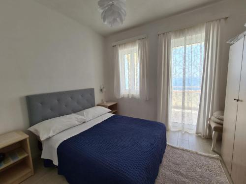 Postel nebo postele na pokoji v ubytování Apartments Adrion