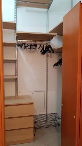 a room with a closet with wine racks at Ex Convento Santa Caterina in Angera