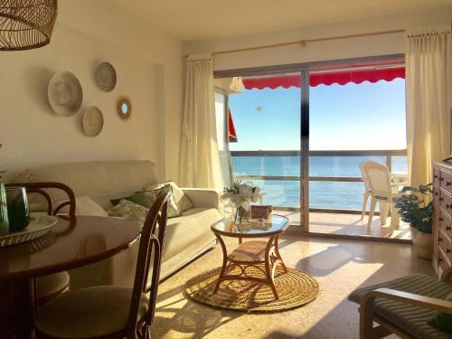 a living room with a view of the ocean at Edificio Calpemar in Calpe