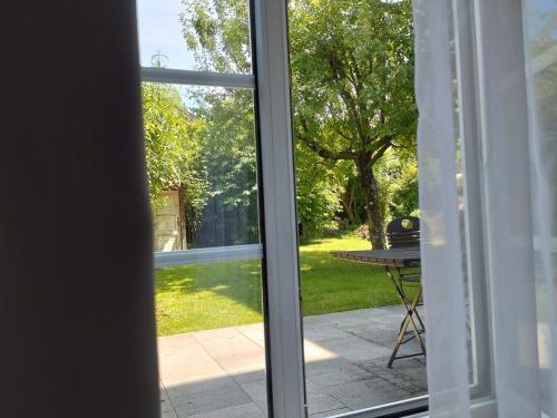 a sliding glass door with a view of a patio at Pension Elisabeth - Rooms & Apartments in Salzburg
