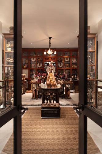 a shop with a statue in the middle of a room at The Siam in Bangkok