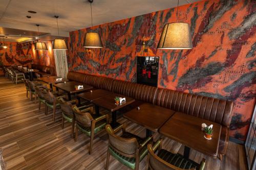 a row of tables and chairs in a restaurant at Levor Hotel in Bursa