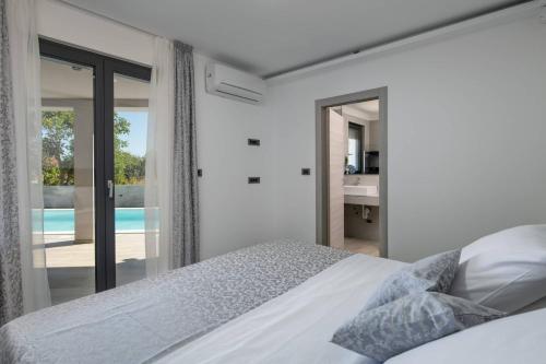 Ένα ή περισσότερα κρεβάτια σε δωμάτιο στο Villa Speranza