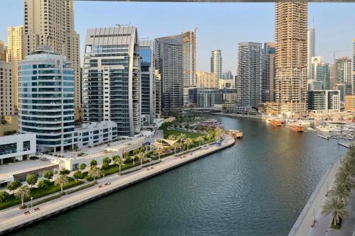a view of a city with a river and buildings at GuestReady - Stunning View from Every Room in Dubai