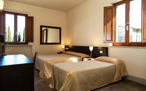 Postel nebo postele na pokoji v ubytování Villa Montarioso