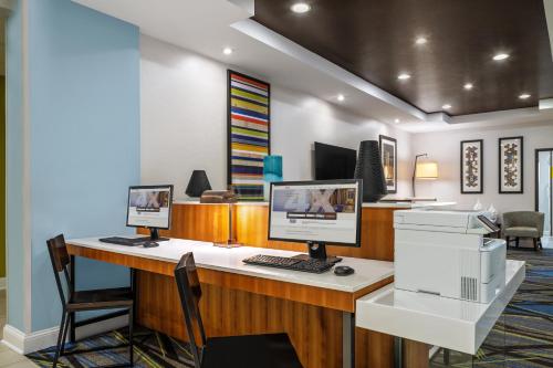 an office with two computer monitors on a desk at Holiday Inn Express & Suites Florence by IHG in Florence