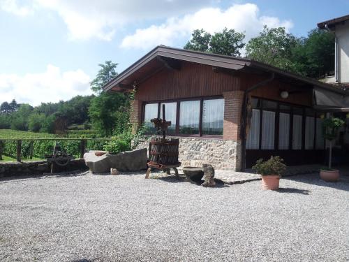 a house with a bench in front of it at Borgo di Corte - alloggio agrituristico in Prestento