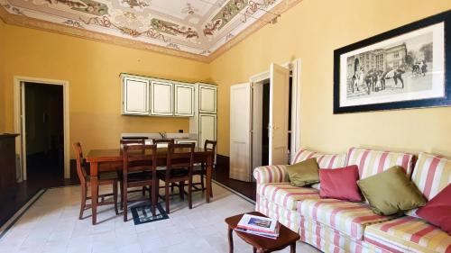 a living room with a couch and a table at Palazzo Gambuzza in Ispica