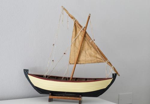 a wooden boat on a stand on a shelf at Las Floridas Apartment in Alghero