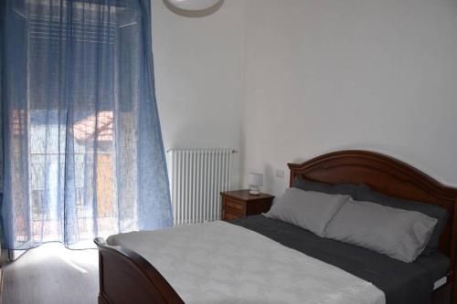 Postel nebo postele na pokoji v ubytování La Resilienza, apartment with view, Carate Urio