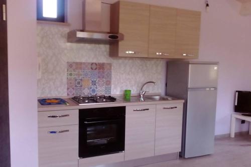 A kitchen or kitchenette at Residenza Flores