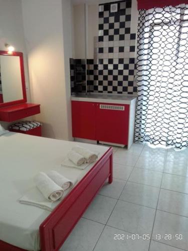 a kitchen with a counter with towels on a table at Olympic Beach Hotel in Nei Poroi