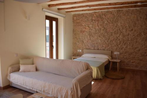 Postel nebo postele na pokoji v ubytování Apartaments Casa el Metge