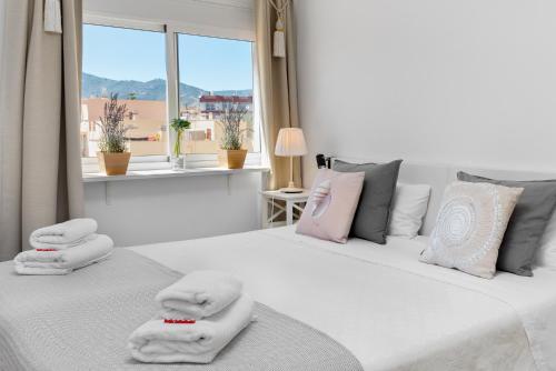 Postel nebo postele na pokoji v ubytování Cozy apartment next to the beach and Nerja center