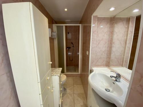 a bathroom with a sink and a toilet at les meublés du soleil in Menton