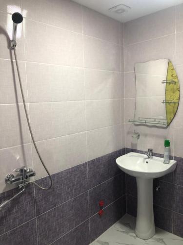 a bathroom with a sink and a mirror at Akhaltsikhe hotel “Sunny House” in Akhaltsikhe