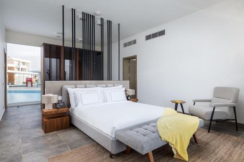Postel nebo postele na pokoji v ubytování The G Hotel Seashell