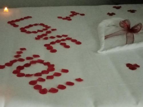a cake with the word love written on it at O Salgueiro in Melo