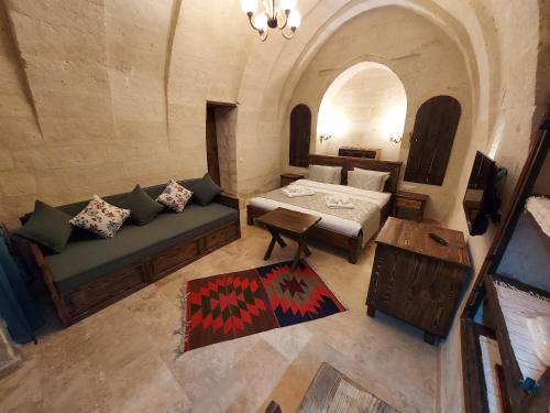 an overhead view of a room with a couch and a bed at ARMEsos Cave Hotel in Urgup