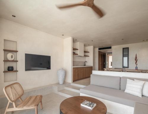 a living room with a couch and a table at Seven Rocks in Paliouri