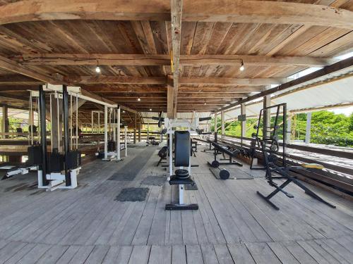 a gym with lots of equipment on a wooden floor at Eco Cabañas Bluekay in Mahahual