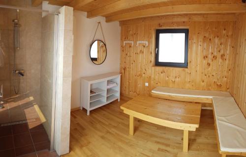 een badkamer met een bank en een douche bij Holiday home in Crikvenica 41598 in Crikvenica