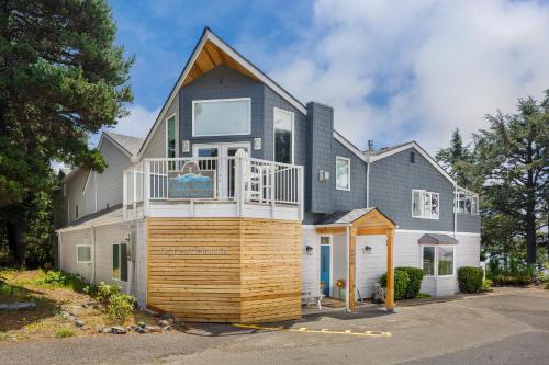 a large house with a deck on top of it at Ocean House in Newport