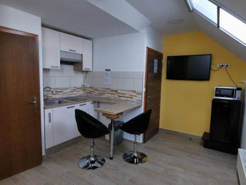 Η κουζίνα ή μικρή κουζίνα στο Apartments Bernard
