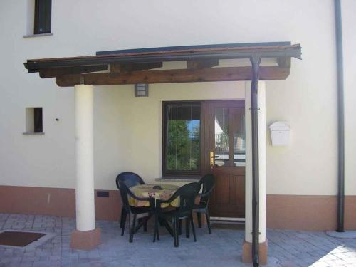 a patio with a table and chairs under awning at Apartment in Postojna 40241 in Postojna