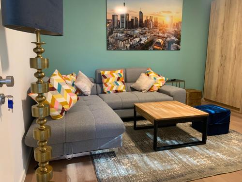 a living room with a couch and a table at ARGENTA Living 2 in Fulda