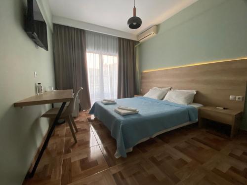 Ένα ή περισσότερα κρεβάτια σε δωμάτιο στο Moudania Mare Hotel